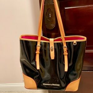 Shiny black leather designer handbag